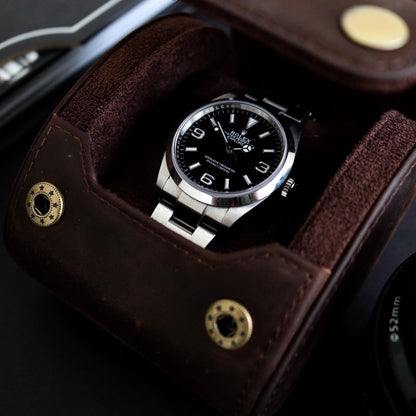 M and Son, leather watch roll containing a Rolex explorer 36mm.