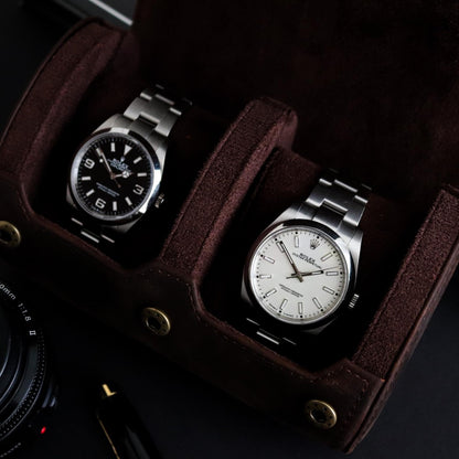 M and Son, double leather watch roll,  containing a Rolex explore and Rolex oyster perpetual inside showing the cushions in use.
