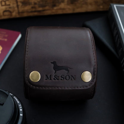 M and Son leather watch roll with a front view of the embossed logo.