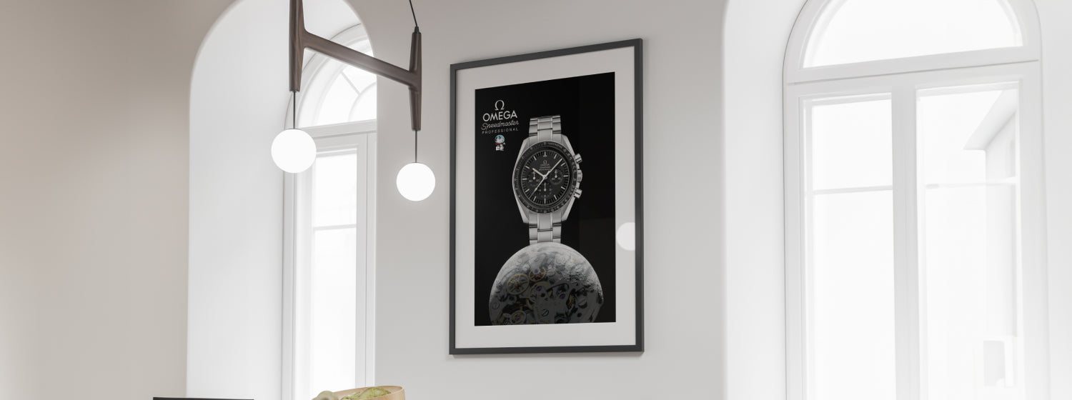Framed poster of a watch on a wall in a room with large windows.