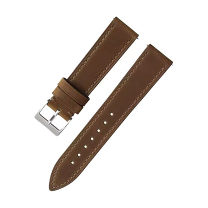 Brown leather watch strap with silver buckle on a white background