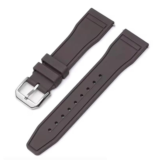 Brown watch strap with silver buckle on a white background