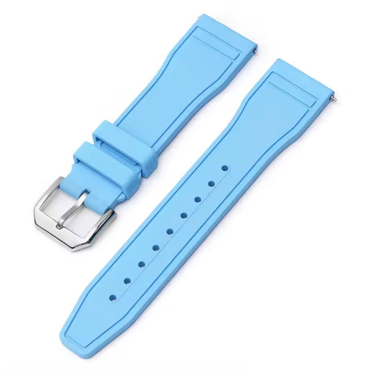 Light blue watch strap with silver buckle on a white background