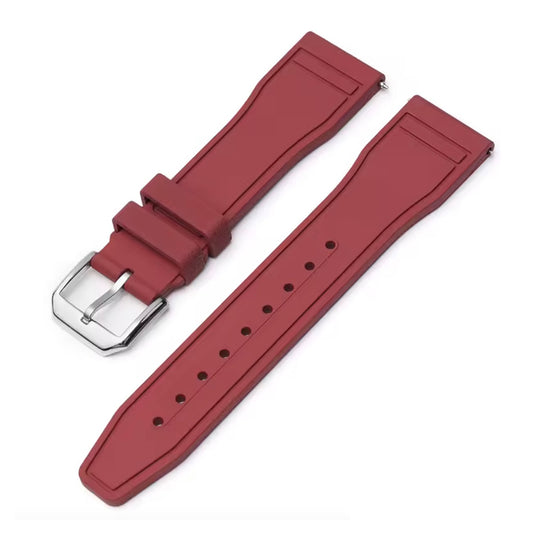 Red watch strap with silver buckle on a white background