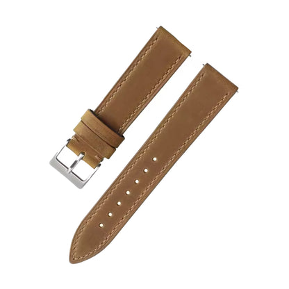 Brown leather watch strap with silver buckle on a white background