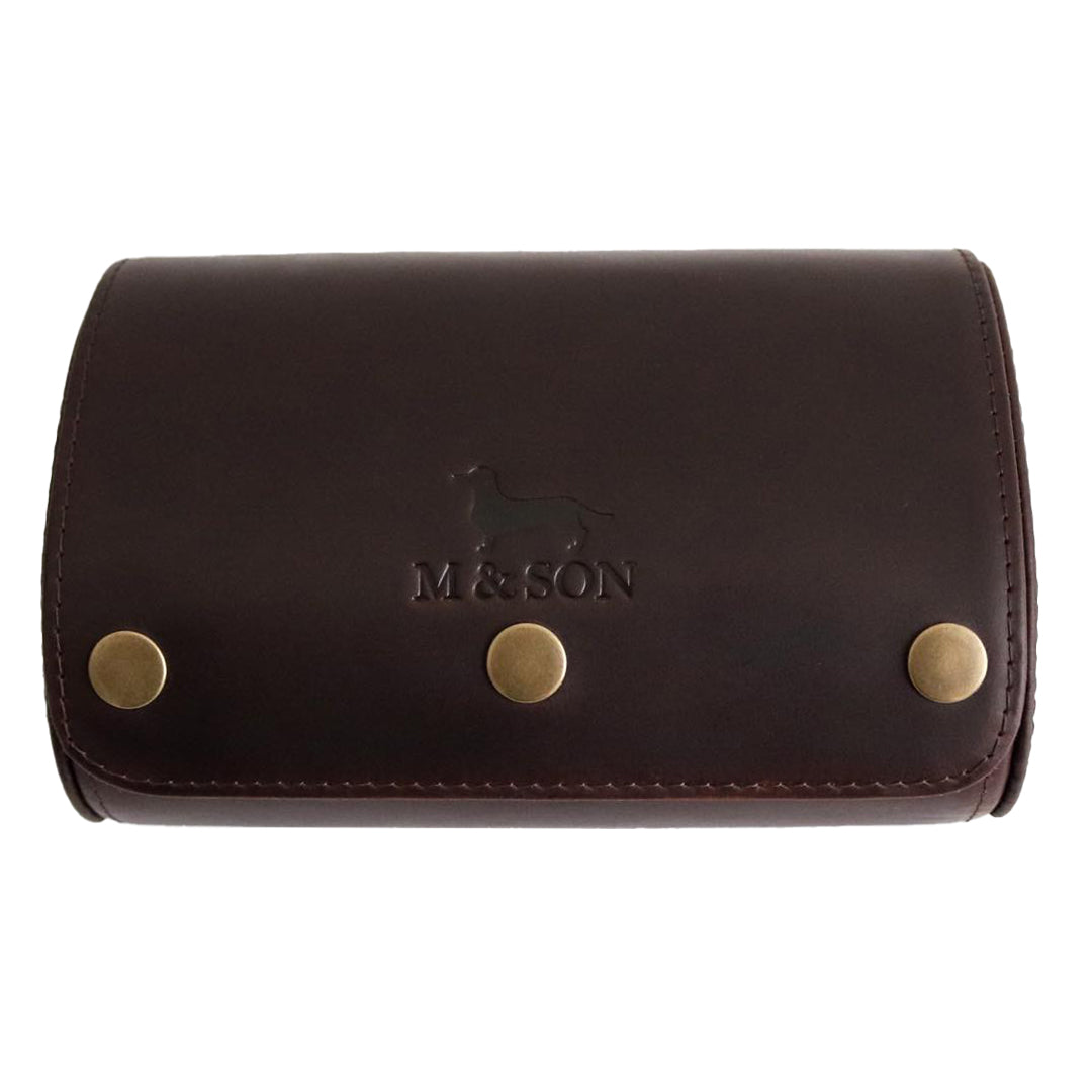 M and Son, double leather watch roll with an embossed logo on a white background.