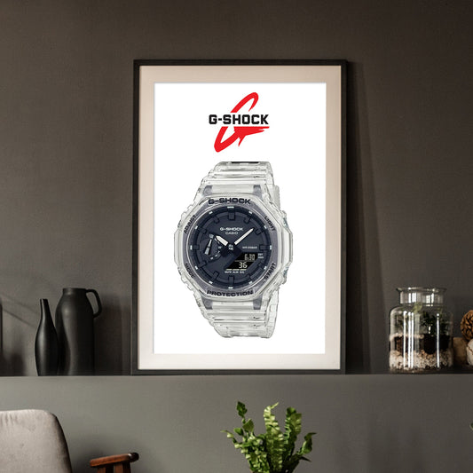 Framed G-Shock watch poster on a wall with decorative items below.