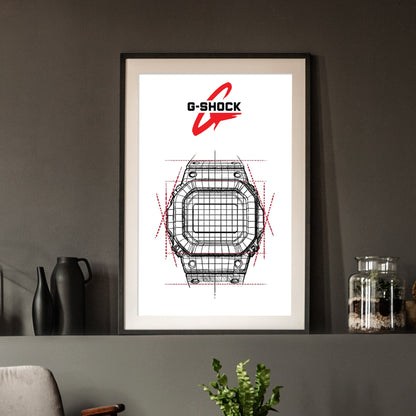 Framed G-Shock watch design art on a wall with decorative items.