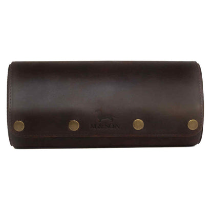 Brown leather triple slot m and son branded watch roll with brass studs on a white background