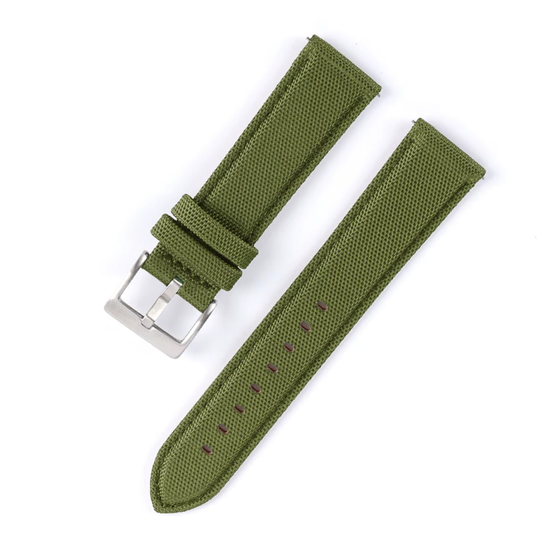 Green watch strap with silver buckle on a white background