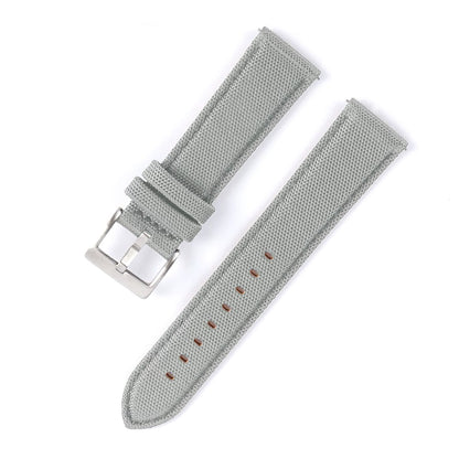 Gray watch strap with metal buckle on a white background