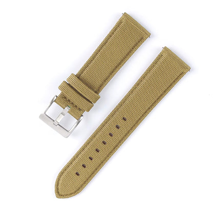 Tan watch strap with silver buckle on a white background