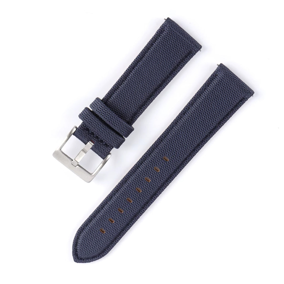Navy blue watch strap with silver buckle on a white background