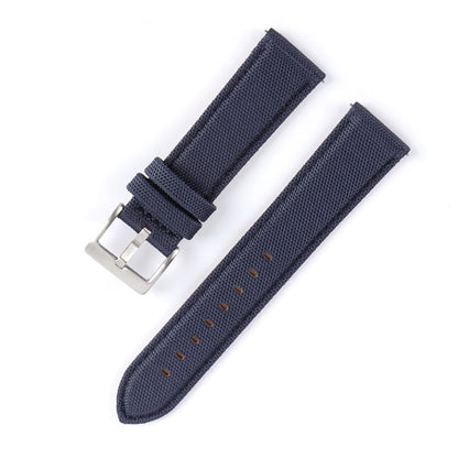 Navy blue watch strap with silver buckle on a white background